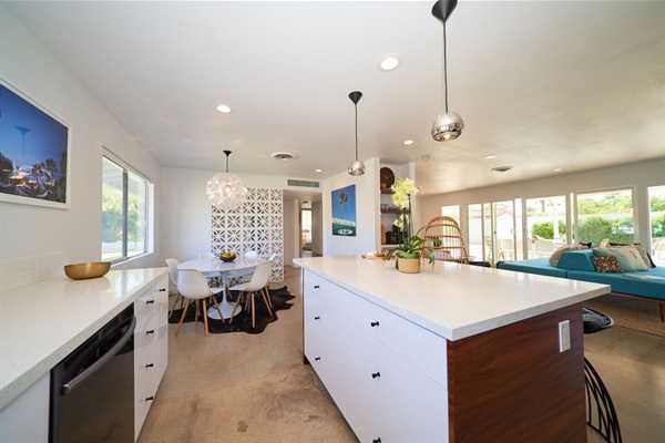 Kitchen island looking through to dining and the turquoise daybed beyond