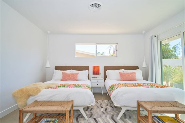 Twin guest beds with clerestory window, cone pendants and woven benches