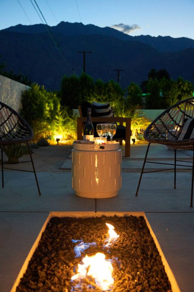 Fire terrace at dusk with woven chairs and mountain view